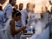 2016-09-03 20:00:21 epa05522865 People take part in the first official Budapest Diner en Blanc at Marcius 15 Square in downtown Budapest, Hungary, 03 September 2016. The international gathering is attended by people dressed in white who share a gourmet dinner with friends. EPA/Zoltan Balogh HUNGARY OUT
