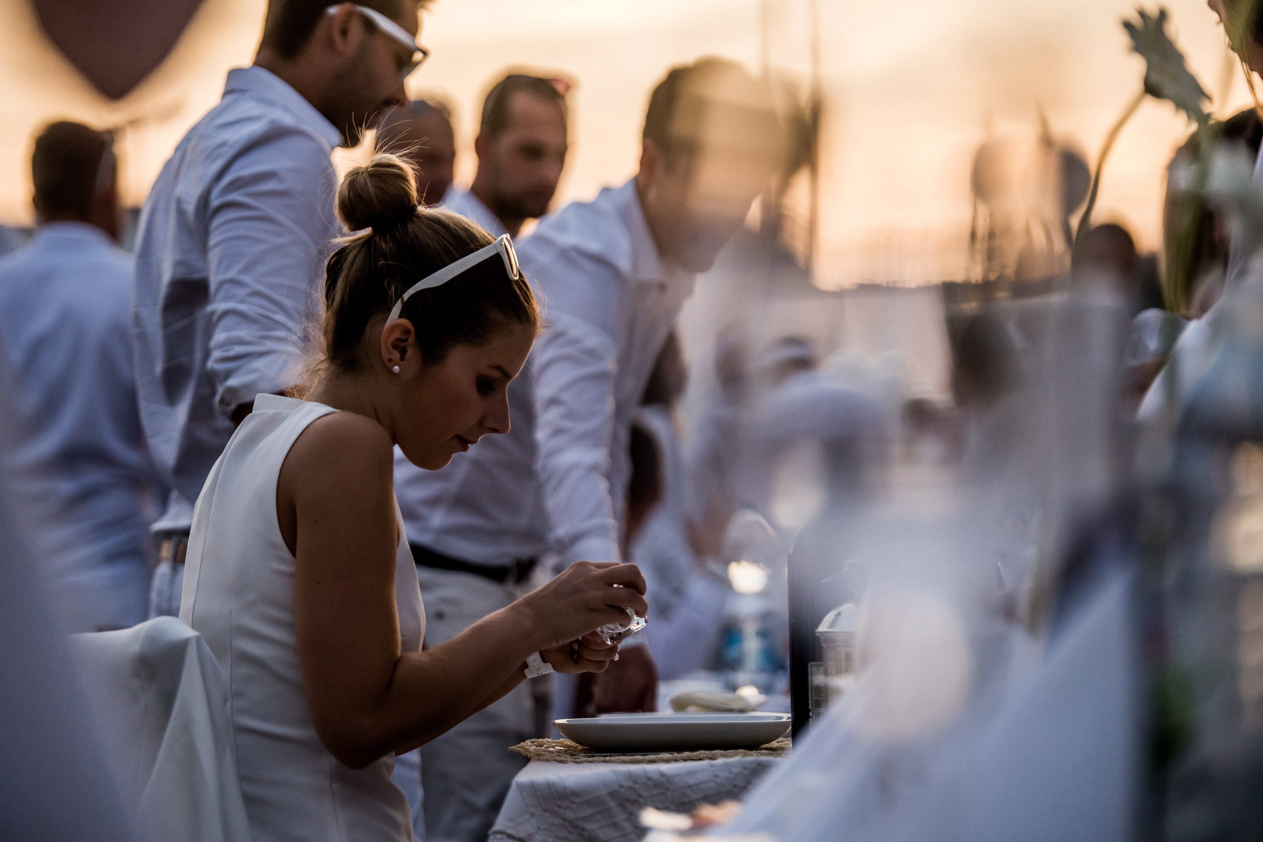 2016-09-03 20:00:21 epa05522865 People take part in the first official Budapest Diner en Blanc at Marcius 15 Square in downtown Budapest, Hungary, 03 September 2016. The international gathering is attended by people dressed in white who share a gourmet dinner with friends. EPA/Zoltan Balogh HUNGARY OUT