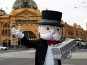 2015-11-10 10:23:19 epa05018717 Mr Monopoly unveils a version of Melbourne Monopoly in Federation Square in Melbourne, Australia, 10 November 2015. Over twenty Melbourne locations feature on the board, which players can move around using an open book, Sherrin football, spray can, racehorse, coffee cup or a W-class tram. EPA/DAVID CROSLING AUSTRALIA AND NEW ZEALAND OUT