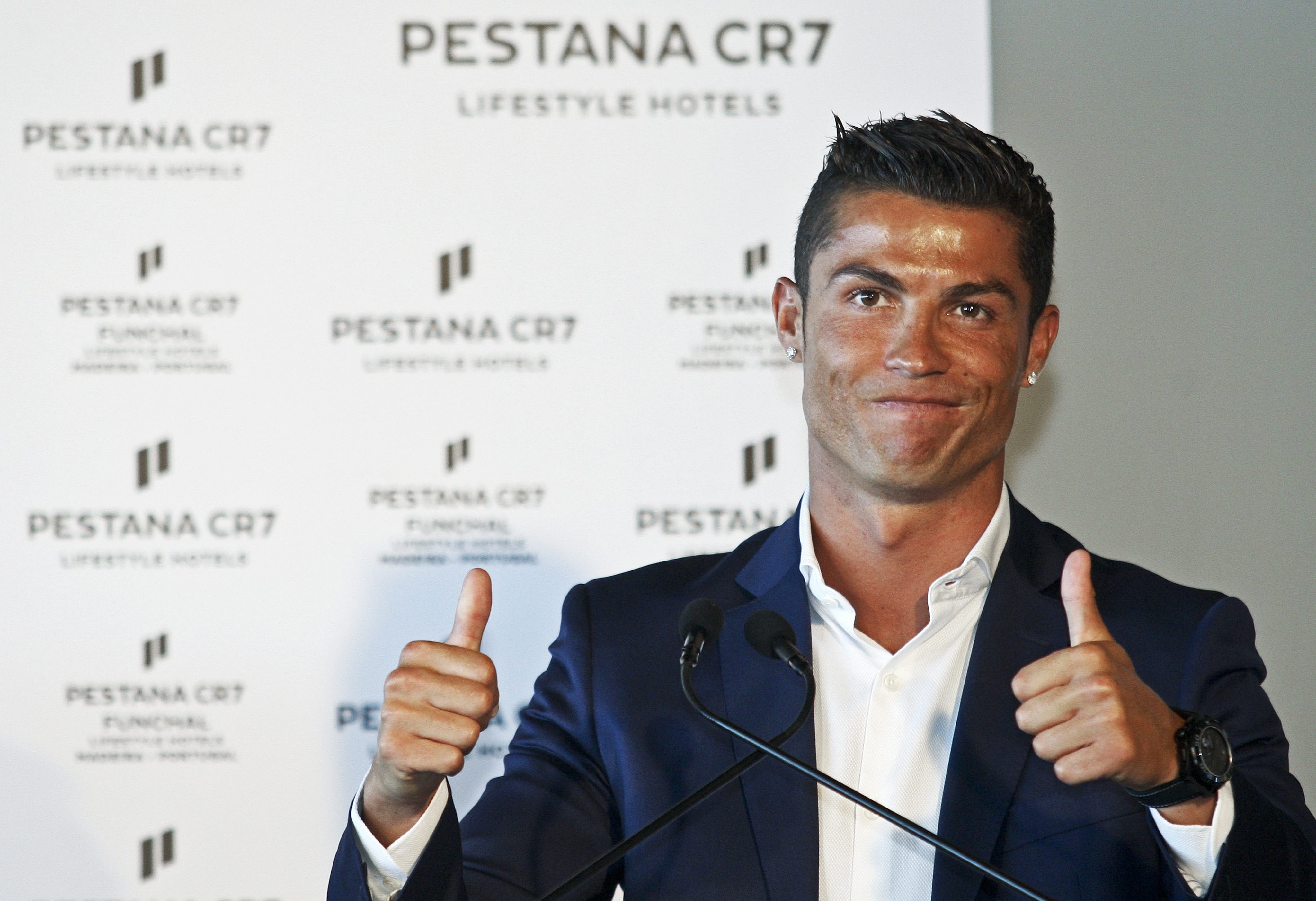 2016-07-22 17:44:54 epa05437160 Portuguese soccer player Cristiano Ronaldo at the opening of the first of four Hotels as a partnership between the Pestana Hotel Group and Cristiano Ronaldo, July 22, 2016. The hotel is already operating since July 1, Funchal, Portugal, July 22. EPA/HOMEM DE GOUVEIA