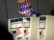 2016-11-08 09:43:19 epa05622908 A man dressed as 'Uncle Sam' votes at Public School 59 on the eastside in New York, New York, USA, 08 November 2016. Americans vote on Election Day to choose the 45th President of the United States of America to serve from 2017 through 2020. EPA/Peter Foley