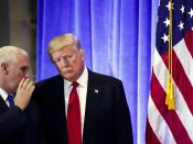2017-01-11 09:01:30 epaselect epa05711343 US President-elect Donald Trump (C) talks with Vice-President-Elect Mike Pence (L) during a press conference in the lobby of Trump Tower in New York, New York, USA, 11 January 2017. Trump, who is set to take the Oath of Office on 20 January 2017, gave his first press conference in nearly 6 months. EPA/JUSTIN LANE