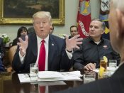 2017-02-02 12:07:01 epa05767168 US President Donald J. Trump (L) speaks beside CEO of Harley Davidson Matthew Levatich (back-R) and US Vice President Mike Pence (front-R), during a meeting with Harley Davidson executives and union representatives in the Roosevelt Room of the White House in Washington, DC, USA, 02 February 2017. EPA/MICHAEL REYNOLDS