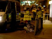 2017-05-23 00:34:13 epaselect epa05982570 A woman sits in the street in a blanket near the Manchester Arena as police guard the area following reports of an explosion, in Manchester, Britain, 23 May 2017. According to a statement released by the Greater Manchester Police on 23 May 2017, police responded to reports of an explosion at Manchester Arena on 22 May 2017 evening. At least 19 people have been confirmed dead and others 50 were injured, authorities said. The happening is currently treated as a terrorist incident until police know otherwise. According to reports quoting witnesses, a mass evacuation was prompted after explosions were heard at the end of US singer Ariana Grande's concert in the arena. EPA/NIGEL RODDIS