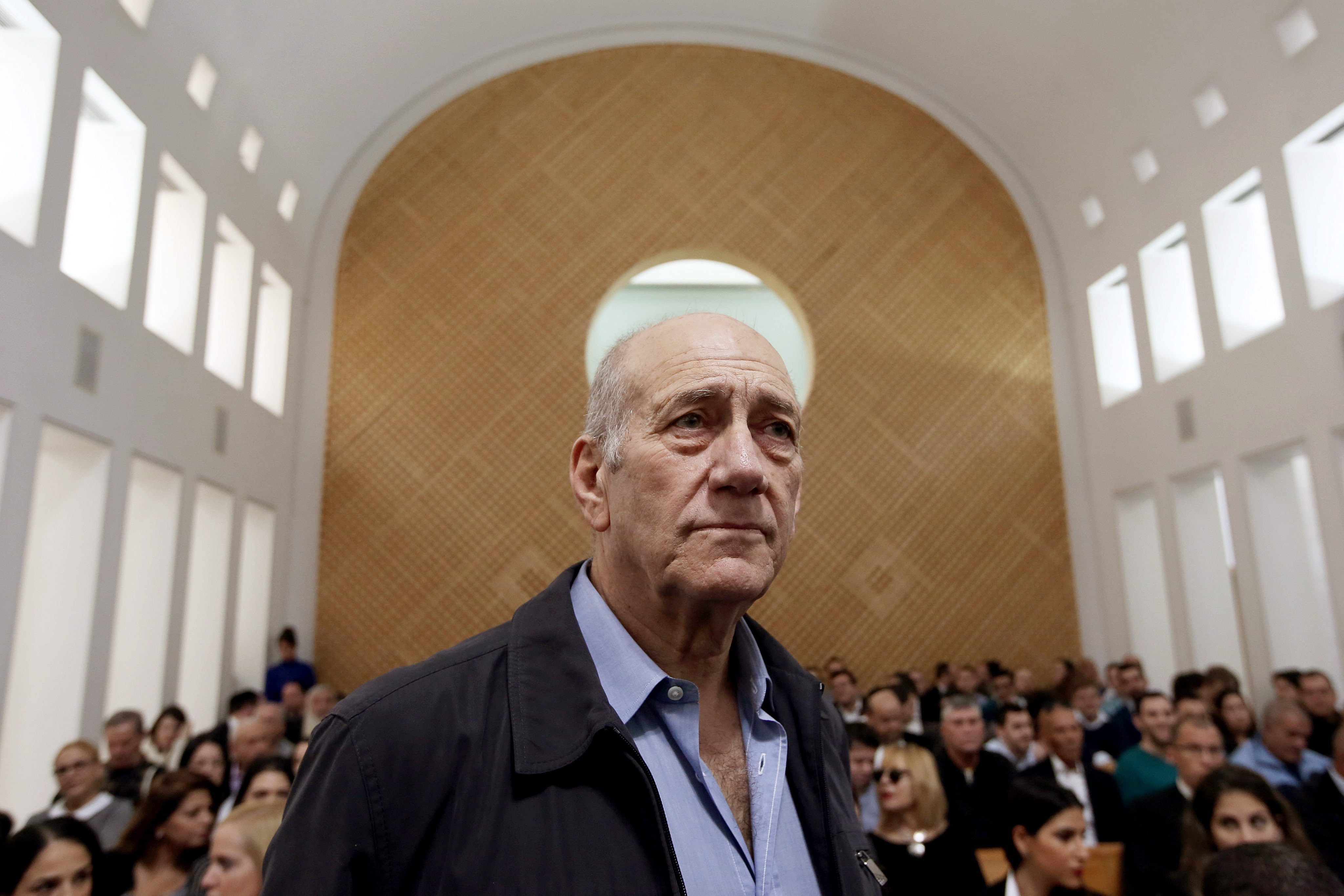 2015-12-29 08:16:54 epa05082860 Former Israeli prime minister Ehud Olmert stands in the court room as he waits for the judges at the Supreme Court in Jerusalem, 29 December 2015. Ehud Olmert will become the first former Israeli prime minister to go to jail after Israel's Supreme Court upheld one count of bribe-taking in a appeal ruling. The court in Jerusalem acquitted Olmert of one major count of bribe-taking when he served as mayor of the city between 1993 and 2003, Israel Radio reported. But it upheld a conviction for a lesser count and dramatically reduced a prison sentence handed to Olmert in May 2014 by Tel Aviv's District Court from six years to 18 months. EPA/GALI TIBBON/POOL