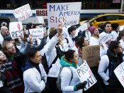 2017-01-30 17:54:23 epa05762040 New York-area medical students gather to protest the proposed plan by the President Donald Trump and the Republican party leadership to repeal the Affordable Care Act (ACA), also known as Obamacare, in New York, New York, USA, 30 January 2017. Tomorrow is the deadline for people to sign up for the current version of the ACA and it unclear how the proposed repeal of the law will take shape. EPA/JUSTIN LANE