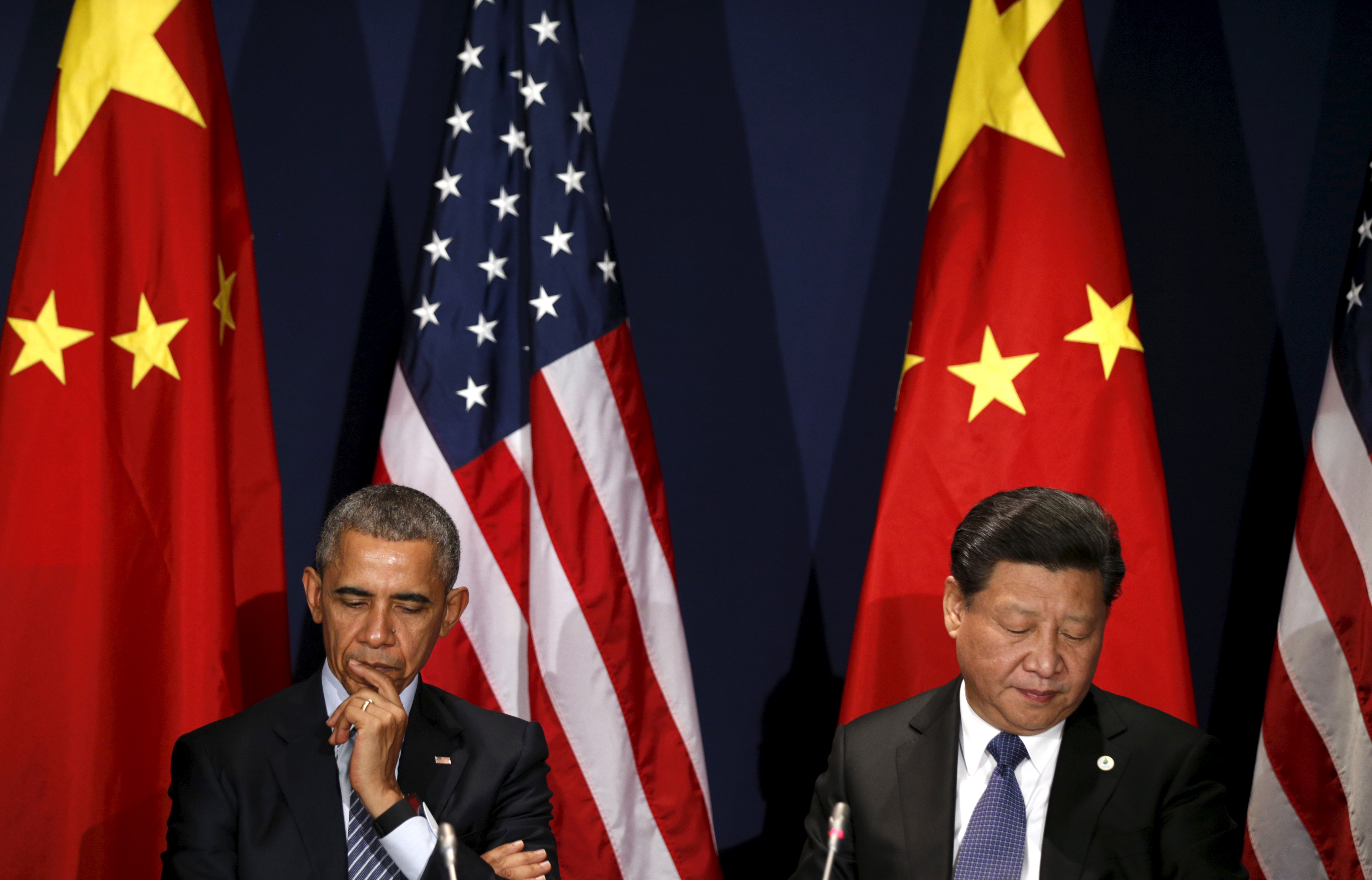 Foton: Reuters. Voormalig president Barack Obama en de Chinese leider Xi Jinping.
