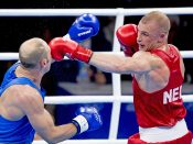 2016-08-08 00:00:35 RIO DE JANEIRO - Peter Mullenberg in actie tegen Ehsan Rouzbahani uit Iran tijdens het bokstoernooi in Riocentro tijdens de Olympische Spelen van Rio. ANP ROBIN UTRECHT