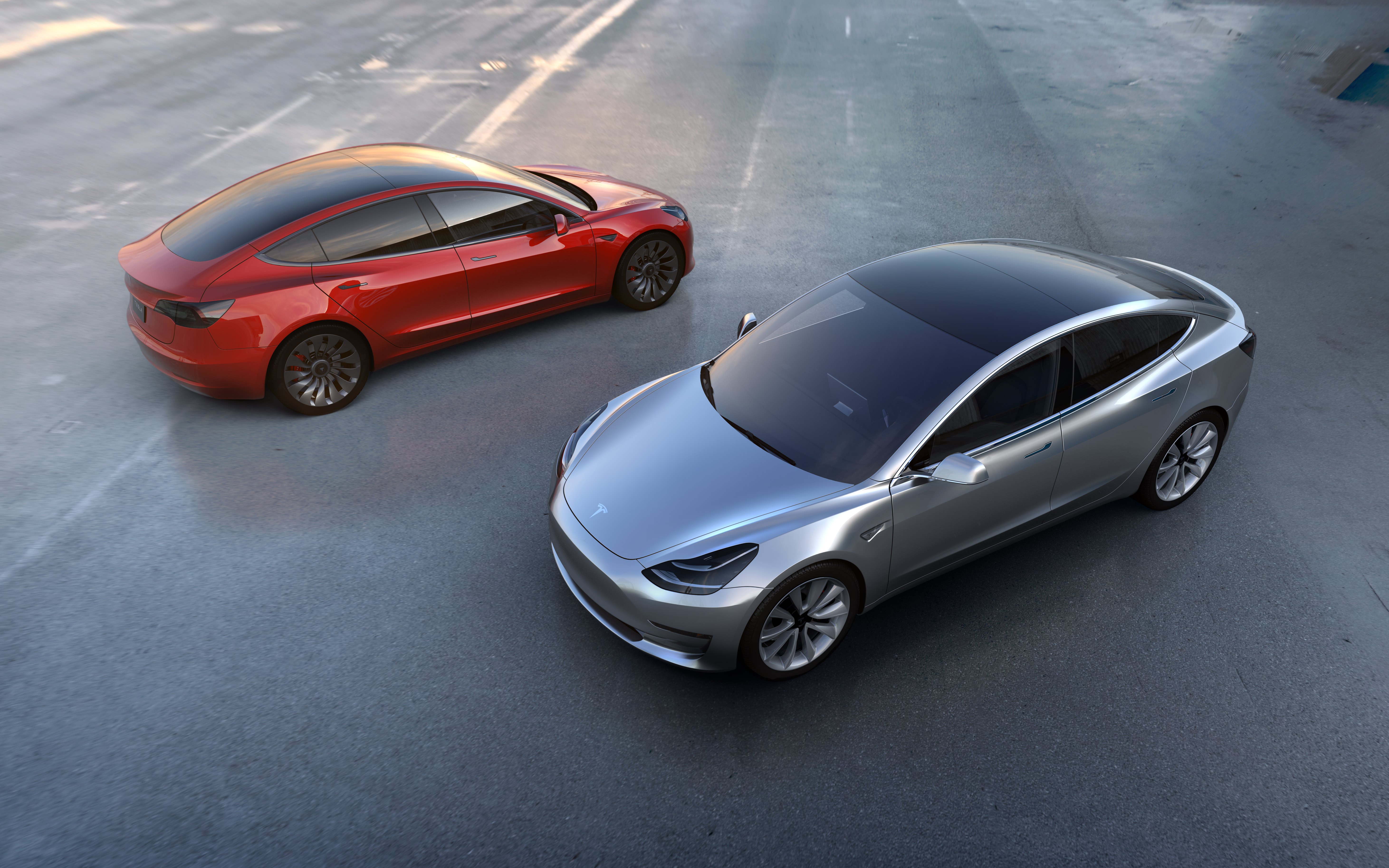 2017-07-03 09:36:17 epa06063955 A undated handout photo made available by Tesla Motors on 03 July 2017 shows Tesla Model 3 in red and silver. The all-electric Model 3 was unveiled on 31 March 2016. According to a tweet by Elon Musk, CEO of Tesla Inc., Model 3 passed all regulatory requirements for production and is expected to be rolling off production line this week. EPA/HANDOUT HANDOUT HANDOUT EDITORIAL USE ONLY/NO SALES