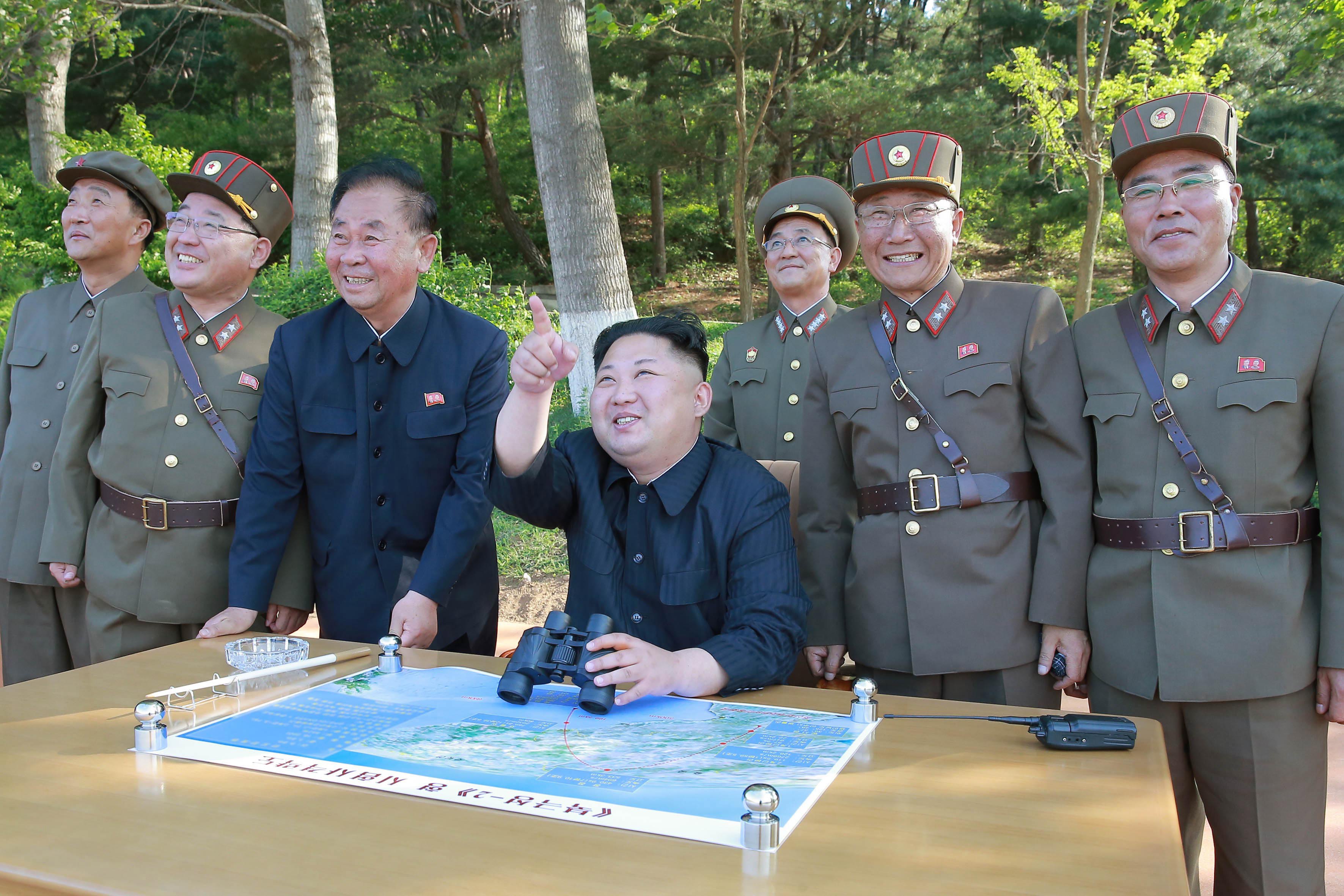 2017-07-29 00:00:00 epa06115683 (FILE) - An undated photo made available by the North Korean Central News Agency (KCNA), the state news agency of North Korea, shows North Korean Supreme Leader Kim Jong-un (C) supervising the test-fire of a ground-to-ground medium-to-long range strategic ballistic missile Pukguksong-2 at an undisclosed location in North Korea (reissued 29 July 2017). According to South Korea's Joint Chiefs of Staff, North Korea has test-fired a ballistic missile into the East Sea on 28 July 2017, from the North's Jagang Province. North Korean leader Kim Jong-un hailed the latest intercontinental ballistic missile test as a success claiming he could strike the entire continental US, state media reported. EPA/KCNA EDITORIAL USE ONLY