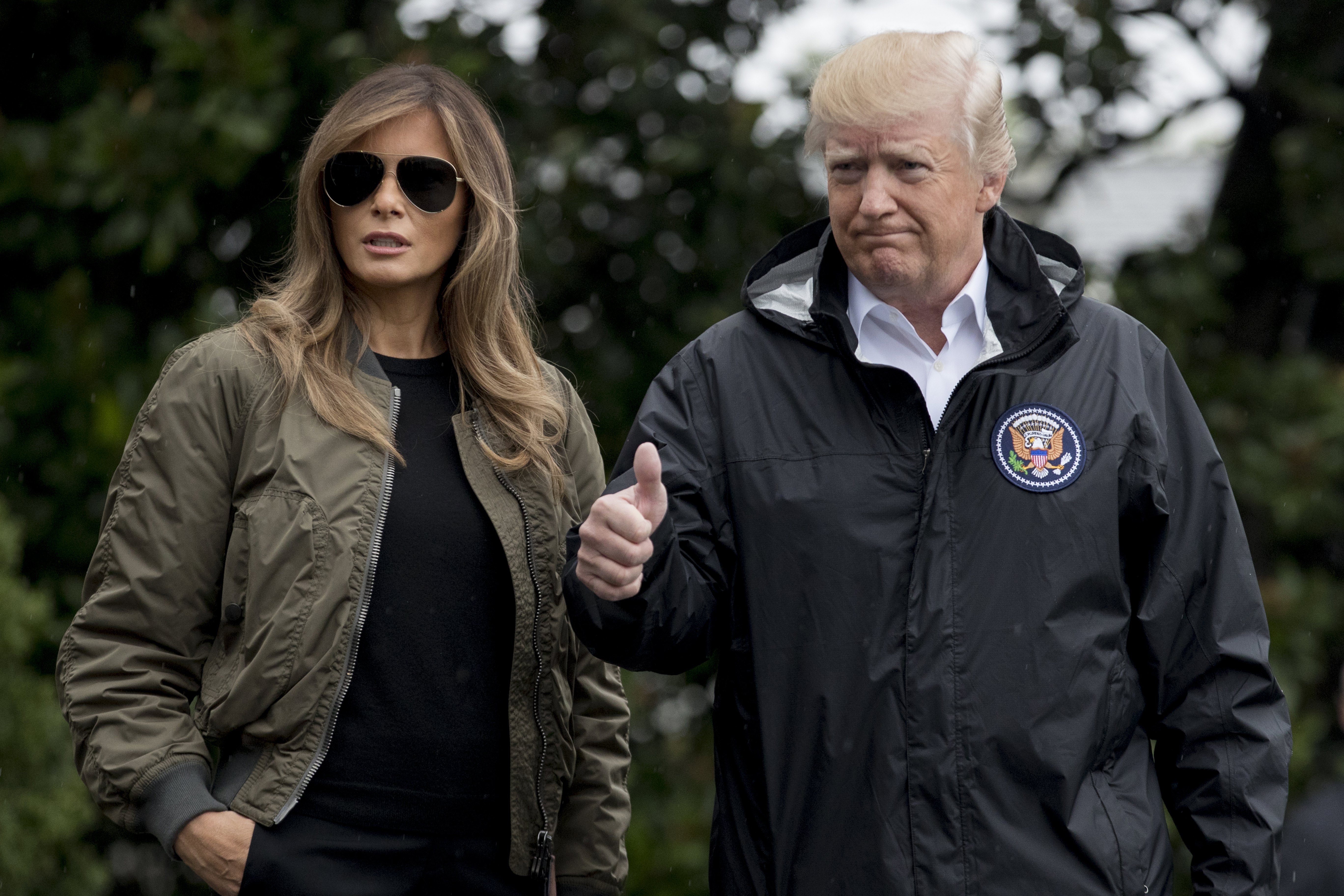 2017-08-29 11:49:11 epa06170124 US President Donald J. Trump (R) and First Lady Melania Trump (L) walk out of the South Portico to depart the South Lawn of the White House by Marine One, in Washington, DC, USA, 29 August 2017. President Trump travels to Texas to inspect storm damage. EPA/MICHAEL REYNOLDS