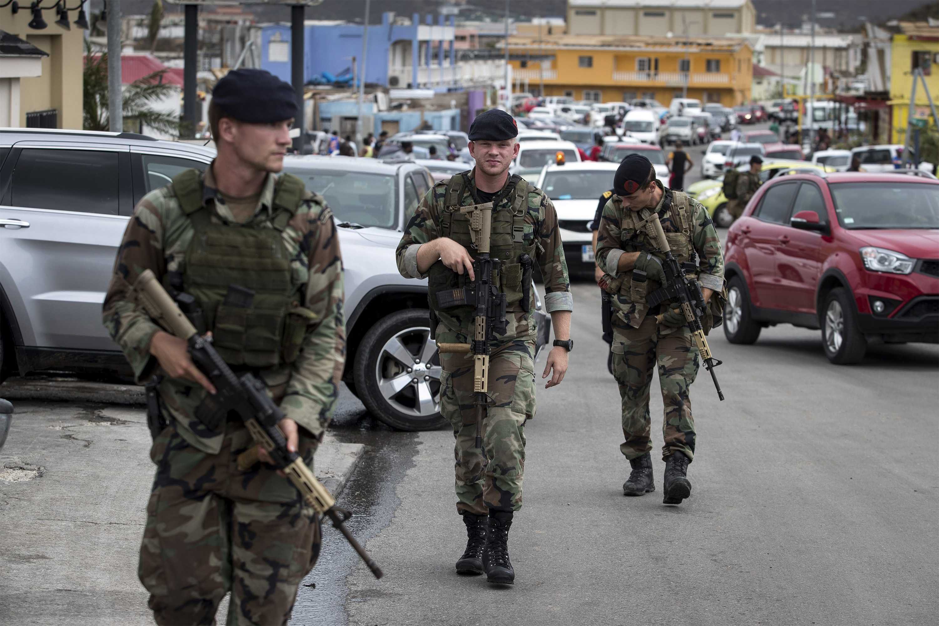 2017-09-07 16:42:50 epa06191559 A handout photo made available by the Dutch Department of Defense on 08 September 2017 shows Dutch soldiers patrolling in Philipsburg, Sint Maarten, on 07 September 2017. Dutch troops arrived at the island territory to help after Hurricane Irma was declared the most powerful hurricane ever recorded over the Atlantic Ocean, and left a path of destruction on Sint Maarten and in the Caribbean as it approaches Florida. Sint Maarten is an autonomous country of the Kingdom of the Netherlands on the Carbbean island of Saint Martin. EPA/GERBEN VAN ES/DUTCH DEPARTMENT OF DEFENSE/HANDOUT HANDOUT EDITORIAL USE ONLY/NO SALES