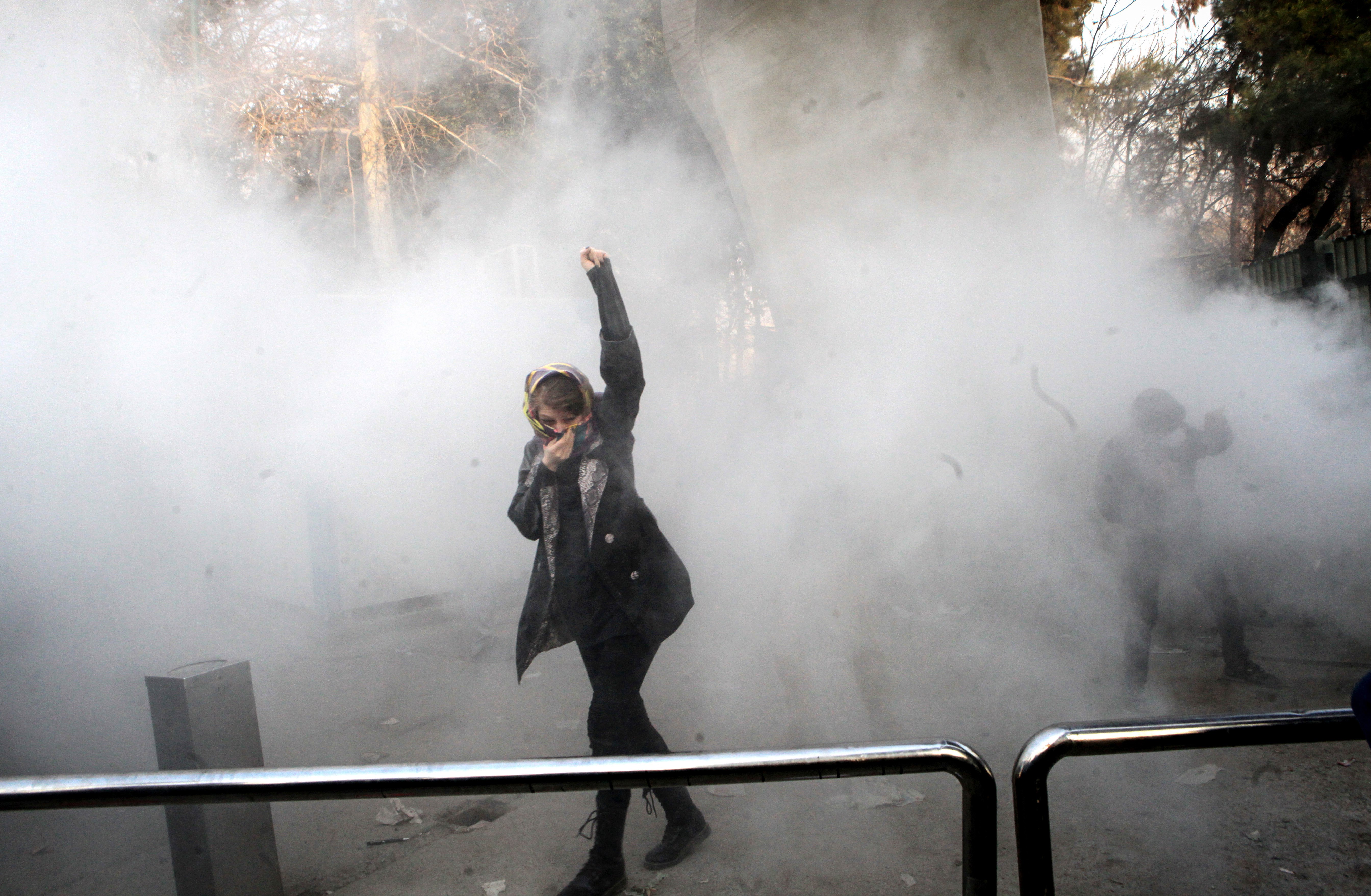 2017-12-30 17:11:35 epa06412625 (FILE) - Iranian students clash with riot police during an anti-government protests around the Tehran University in Tehran, Iran, 30 December 2017. Media reported on 01 January 2018 that the anti-regime protests in Iran are continuing. According to Iranian state television on 01 January 2018, ten demonstrators have reportedly died during the current protests. EPA/STR