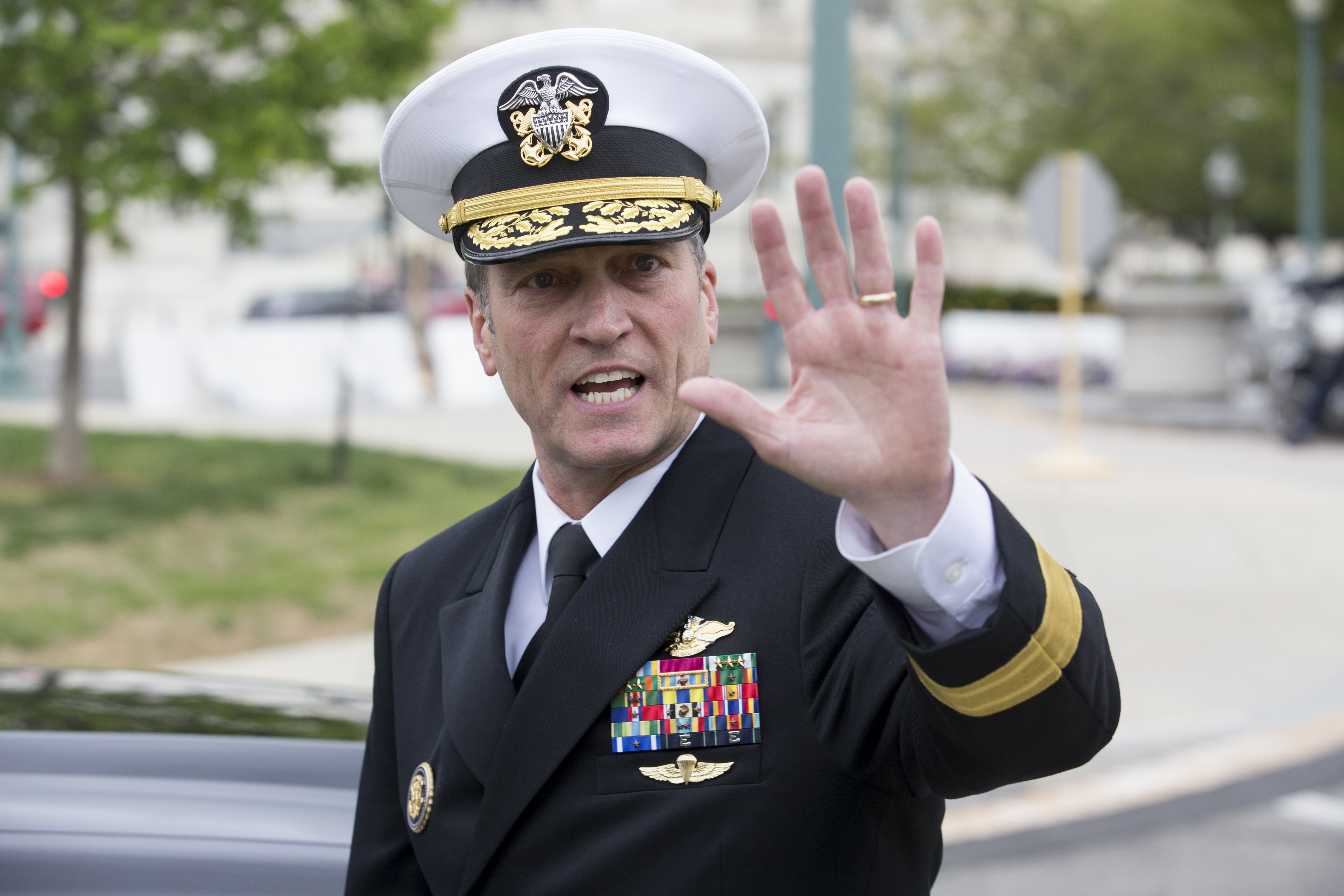 2018-04-24 12:17:37 epa06689825 US Navy Rear Admiral Ronny Jackson, US President Donald J. Trump's nominee to be Secretary of Veteran Affairs, waves to members of the news media following a meeting in the office of Republican Senator from Kansas Jerry Moran, on Capitol Hill in Washington, DC, USA, 24 April 2018. The Senate Veterans Affairs Committee has postponed Jackson's confirmation hearing amid allegations involving his behavior as a White House physician. If confirmed by the Senate, Jackson would fill the vacancy left by the exit of David Shulkin. EPA/MICHAEL REYNOLDS