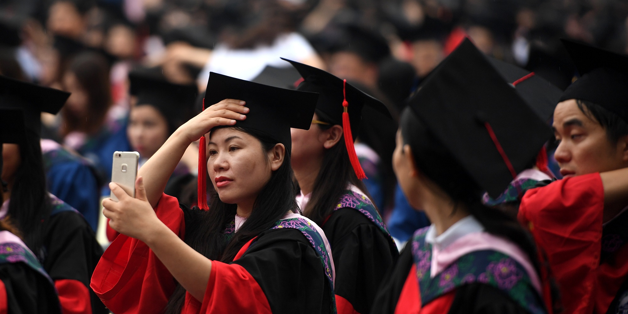 Graduates attend the graduation ceremony of Wuhan University on June 22, 2018 in Wuhan, Hubei Province of China.