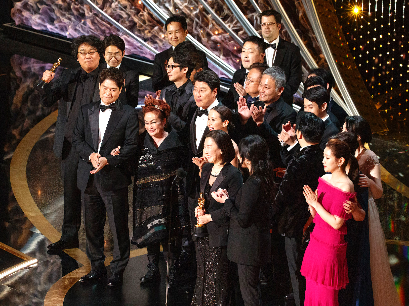 Tom Hanks and Charlize Theron led a cheer to turn the Oscars stage