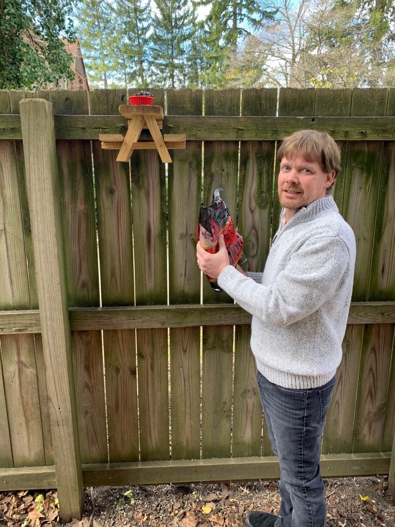 A man built a tiny picnic table for squirrels in his ...