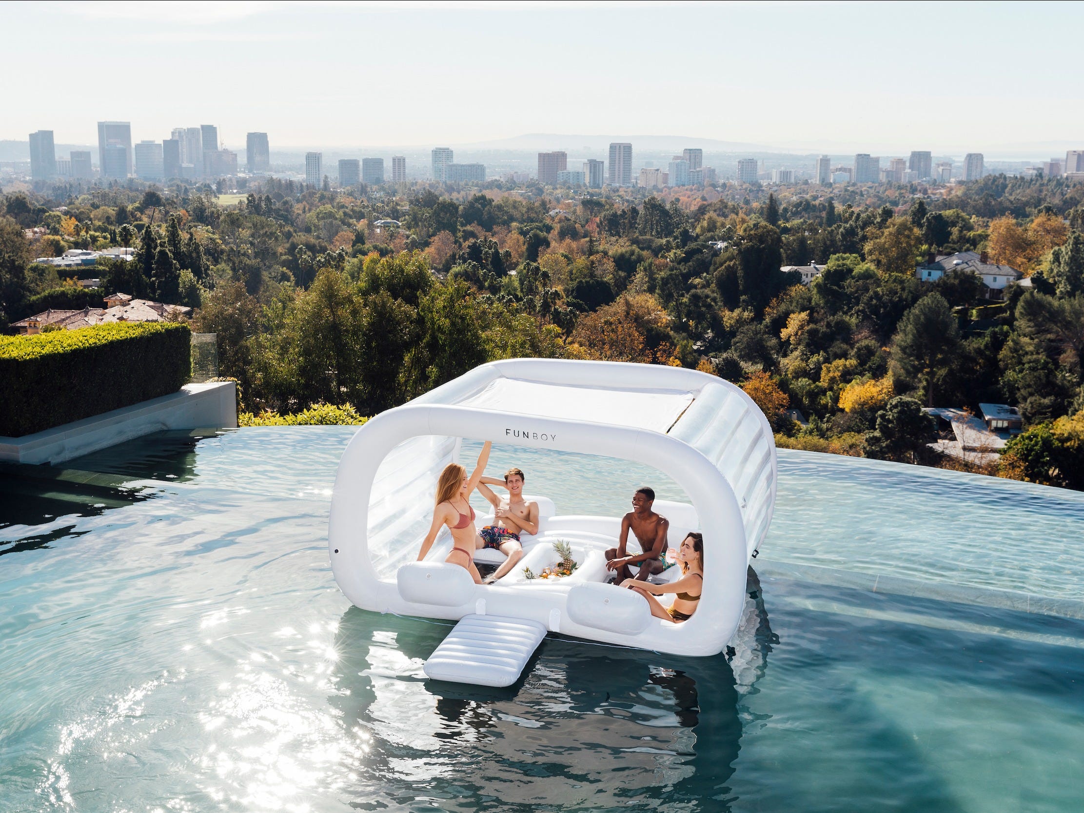 This giant cabana pool float fits 4 people and has an ice cooler for ...