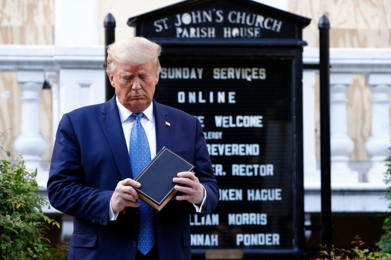 Donald Trump President Donald Trump holds a Bible as he visits outside St. John's Church across Lafayette Park from the White House Monday, June 1, 2020, in Washington DC.