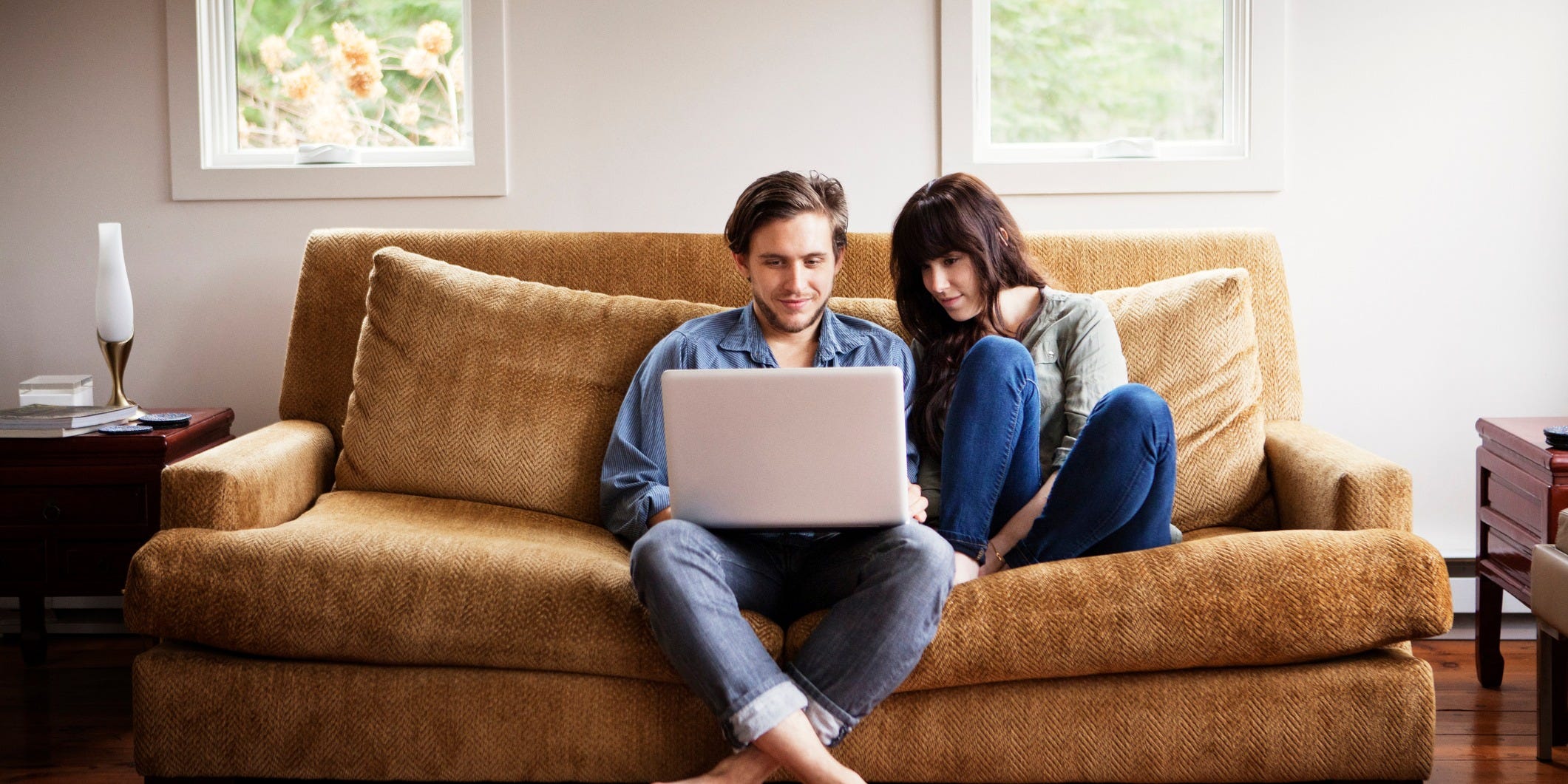 Use room. People in Living Room. Man sitting in Living Room. Happy person sitting in Living Room. Couple on Sofa.