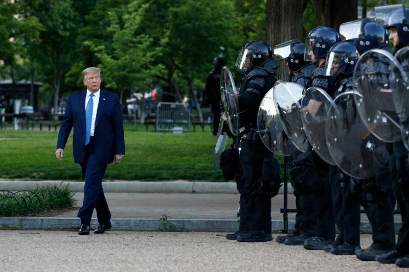 Donald Trump President Donald Trump walks past police in Lafayette Park after visiting outside St. John's Church across from the White House Monday, June 1, 2020, in Washington. Part of the church was set on fire during protests on Sunday night. (AP Photo/Patrick Semansky)