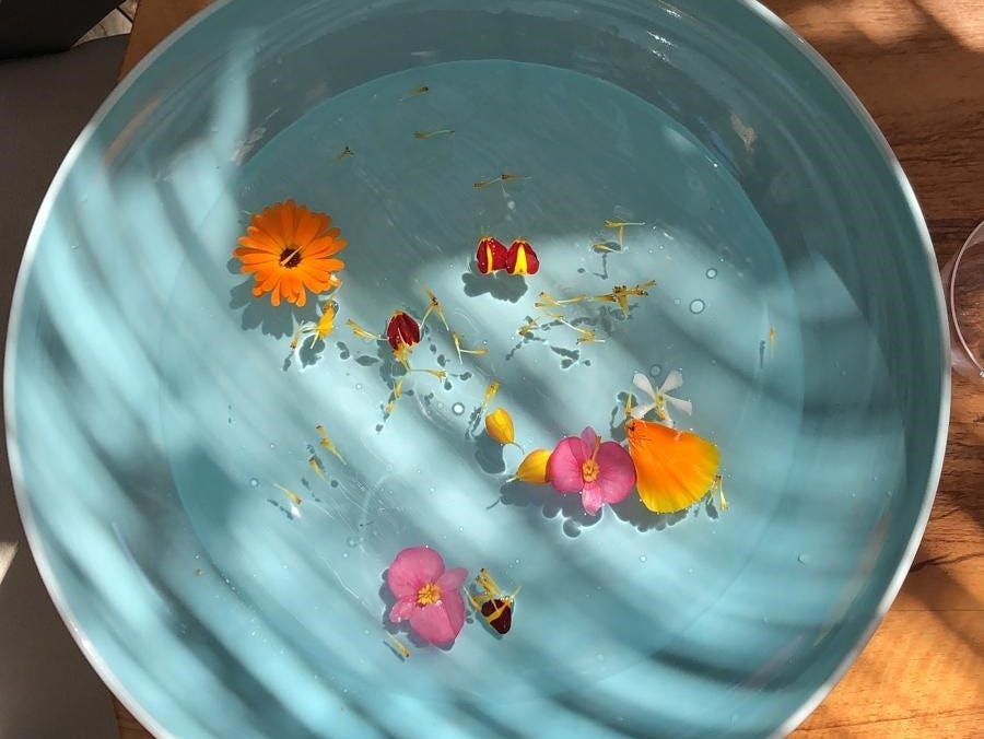 Mirazur's homemade hand sanitizer, coordinated for a flower-themed dinner.