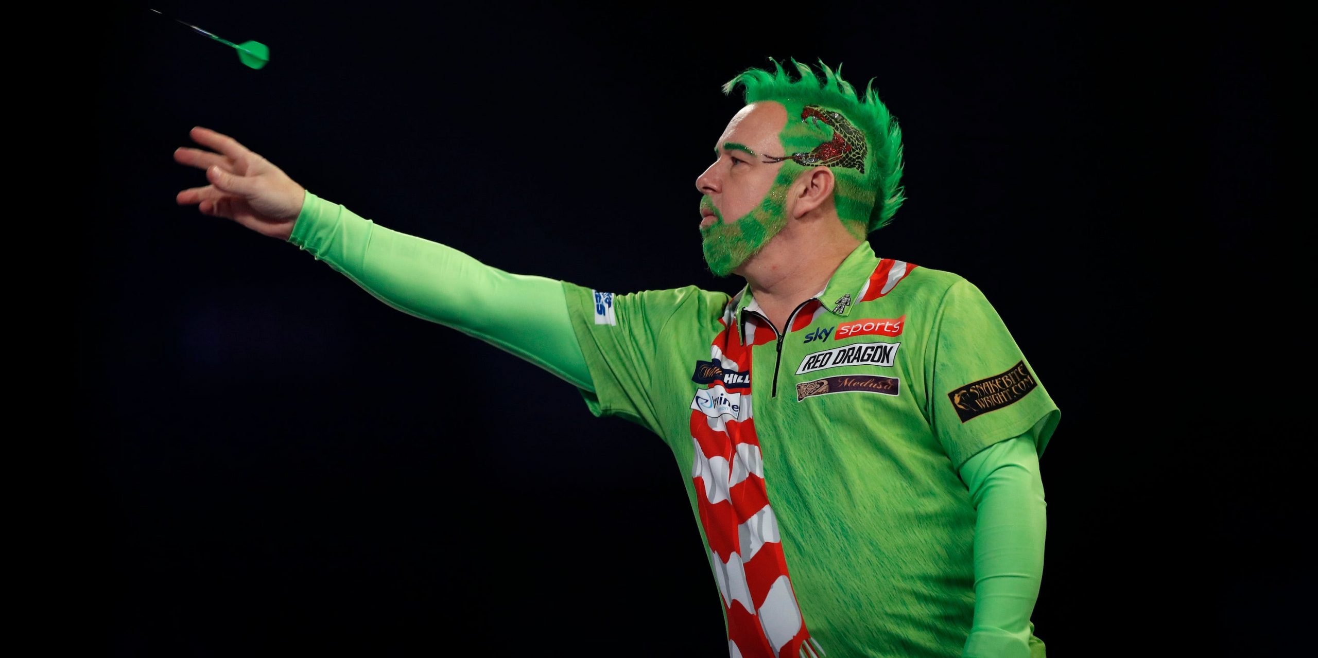The world darts champion dyed his eyebrows bright green and dressed up