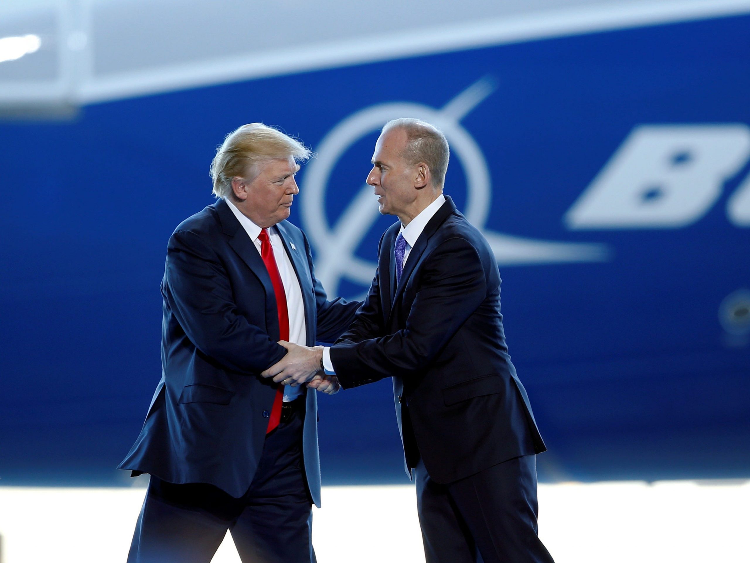 FILE PHOTO: U.S. President Donald Trump greets Boeing Chairman, President and CEO Dennis Muilenburg in North Charleston, South Carolina, U.S. February 17, 2017.  REUTERS/Randall Hill/File Photo