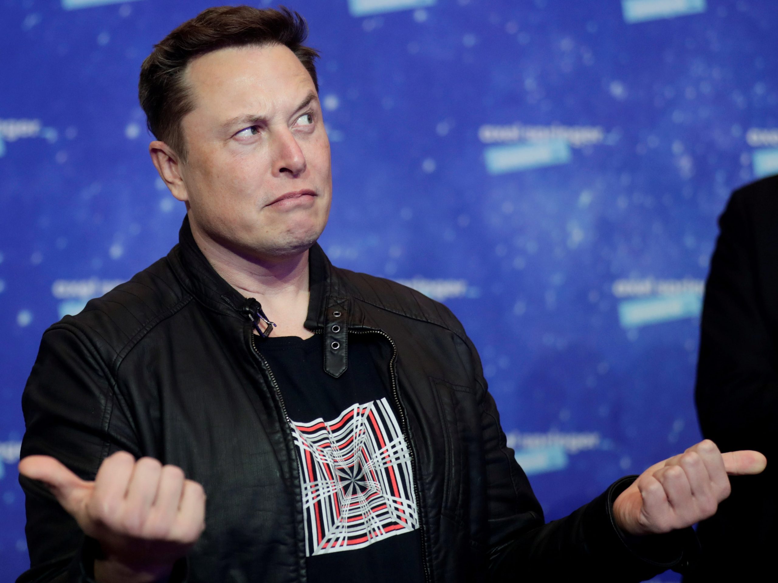 elon musk confused skeptical thumbs grimace