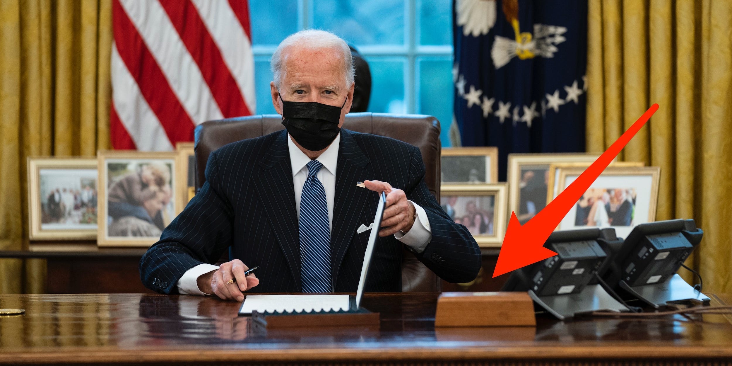 President Joe Biden looks up after singing an Executive Order reversing the Trump era ban on Transgender serving in military, in the Oval Office of the White House, Monday, Jan. 25, 2021, in Washington.