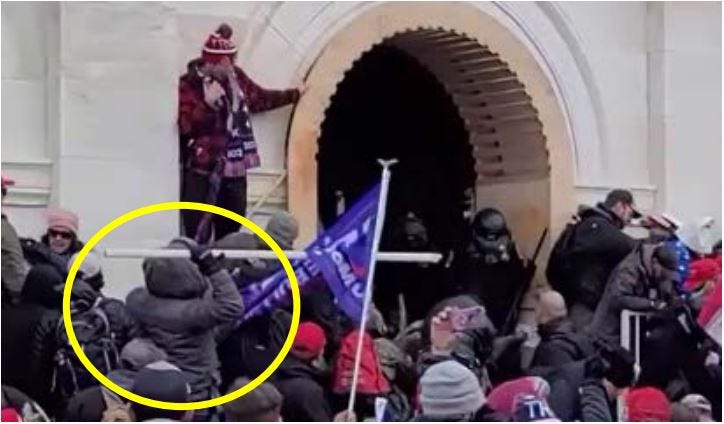 Foy allegedly throwing a sharpened pole at Capitol Police officers