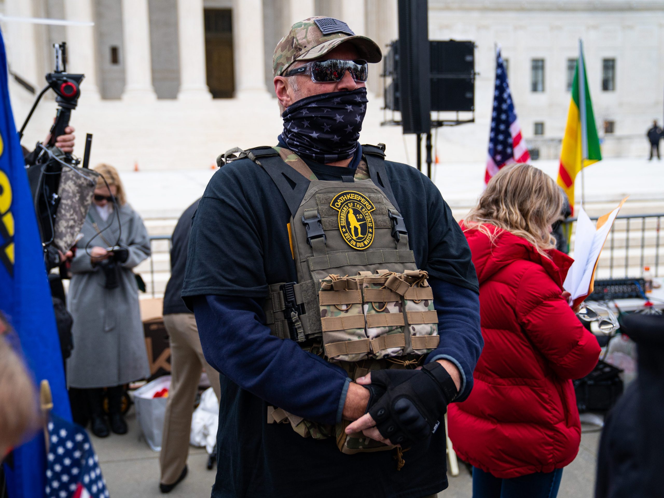 GettyImages 1294712646 WASHINGTON, DC - JANUARY 05: A member of the right-wing group Oath Keepers stands guard during a rally in front of the U.S. Supreme Court Building on January 5, 2021 in Washington, DC. Today's rally kicks off two days of pro-Trump events fueled by President Trump's continued claims of election fraud and a last-ditch effort to overturn the results before Congress finalizes them on January 6. (Photo by Robert Nickelsberg/Getty Images)