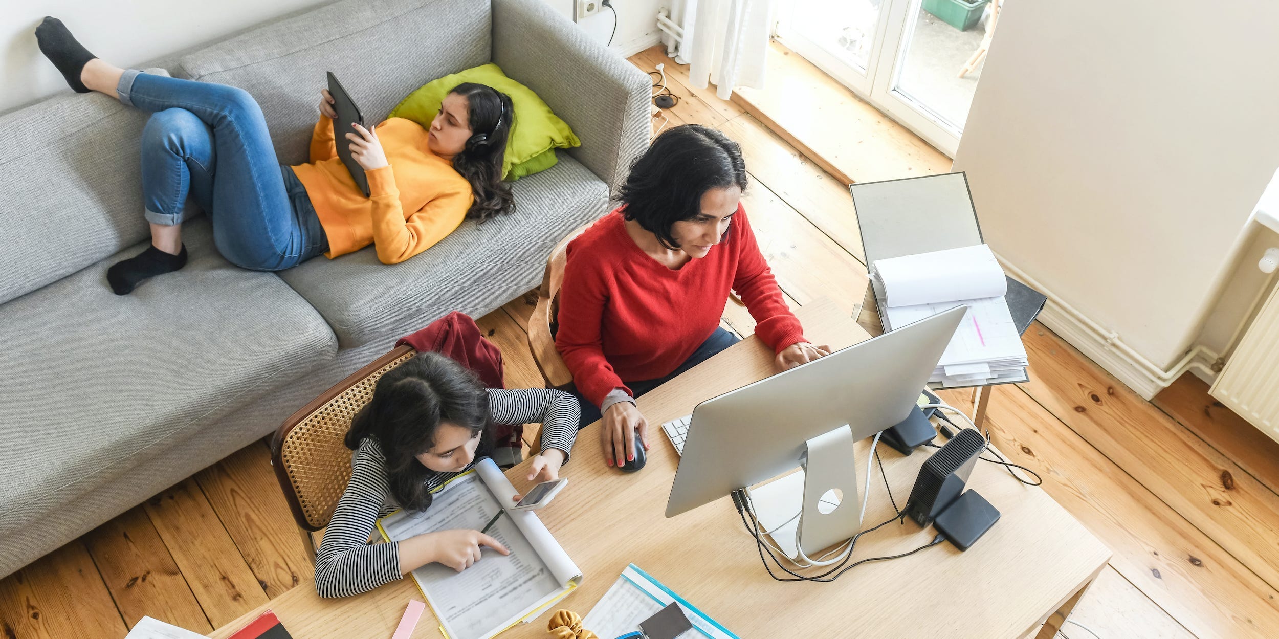 family using home wifi laptop tablet
