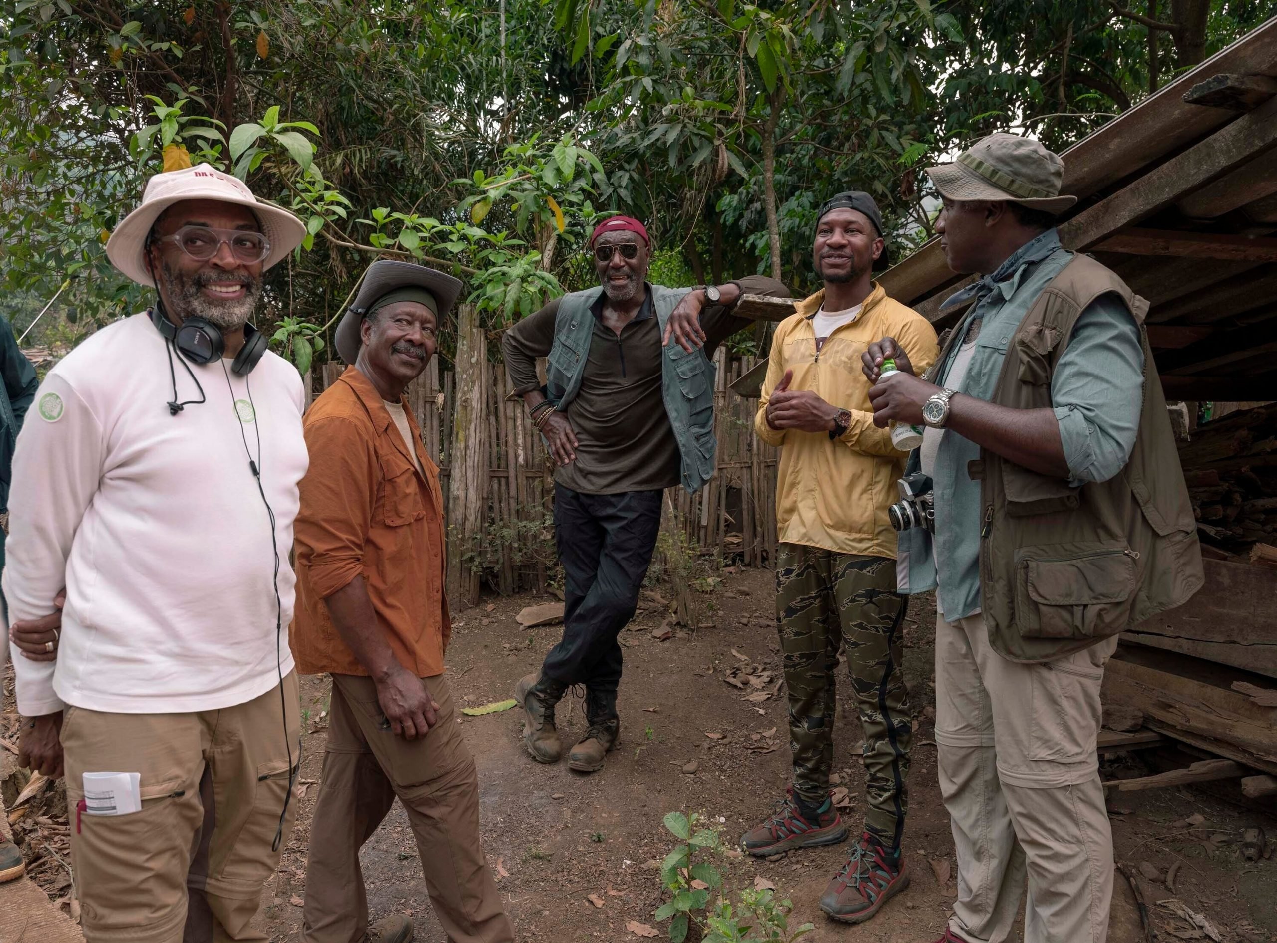 This image released by Netflix shows, from left, filmmaker Spike Lee, from left, with Clarke Peters, Delroy Lindo, Jonathan Majors and Norm Lewis on the set of "Da 5 Bloods." (David Lee/Netflix via AP)