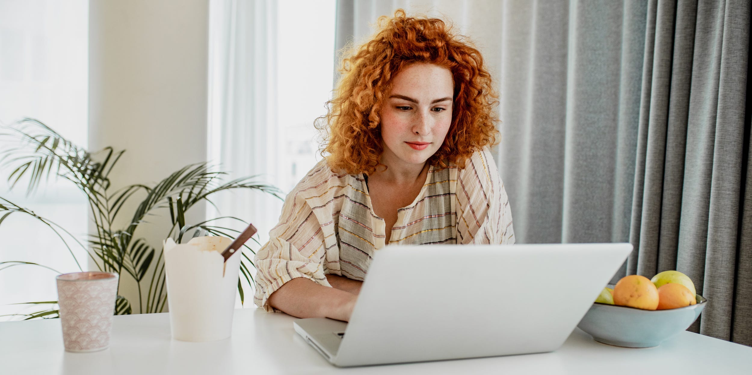 woman working from home on laptop organized