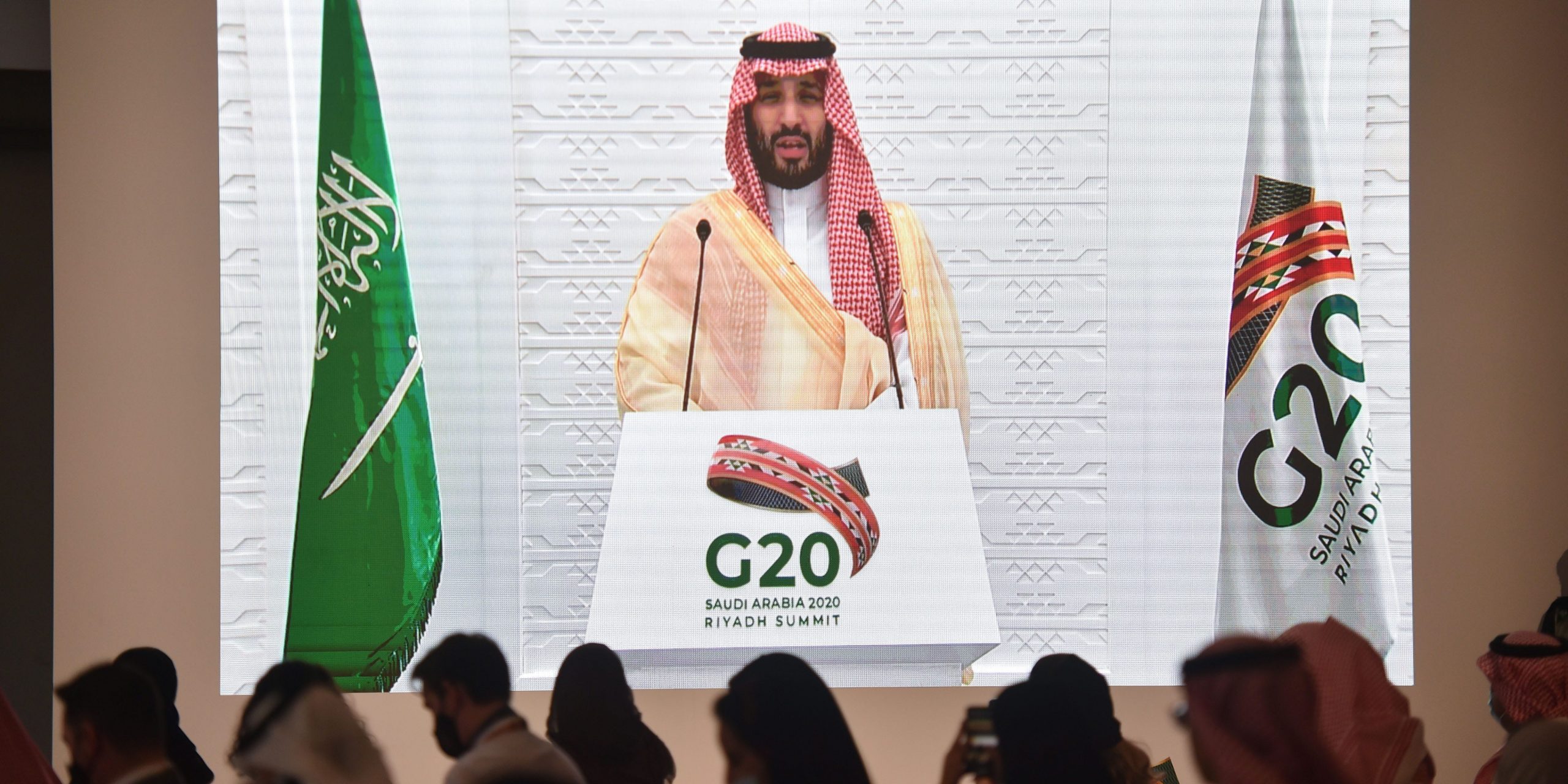 Saudi and foreign media representatives listen to Saudi Crown Prince Mohammed bin Salman remotely addressing a press conference, at the G20 summit's Media Center in the capital Riyadh, on November 22, 2020. (Photo by FAYEZ NURELDINE / AFP) (Photo by FAYEZ NURELDINE/AFP via Getty Images)