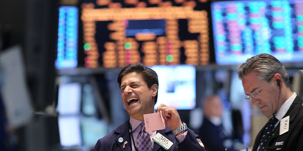 Traders work on the floor of the New York Stock exchange