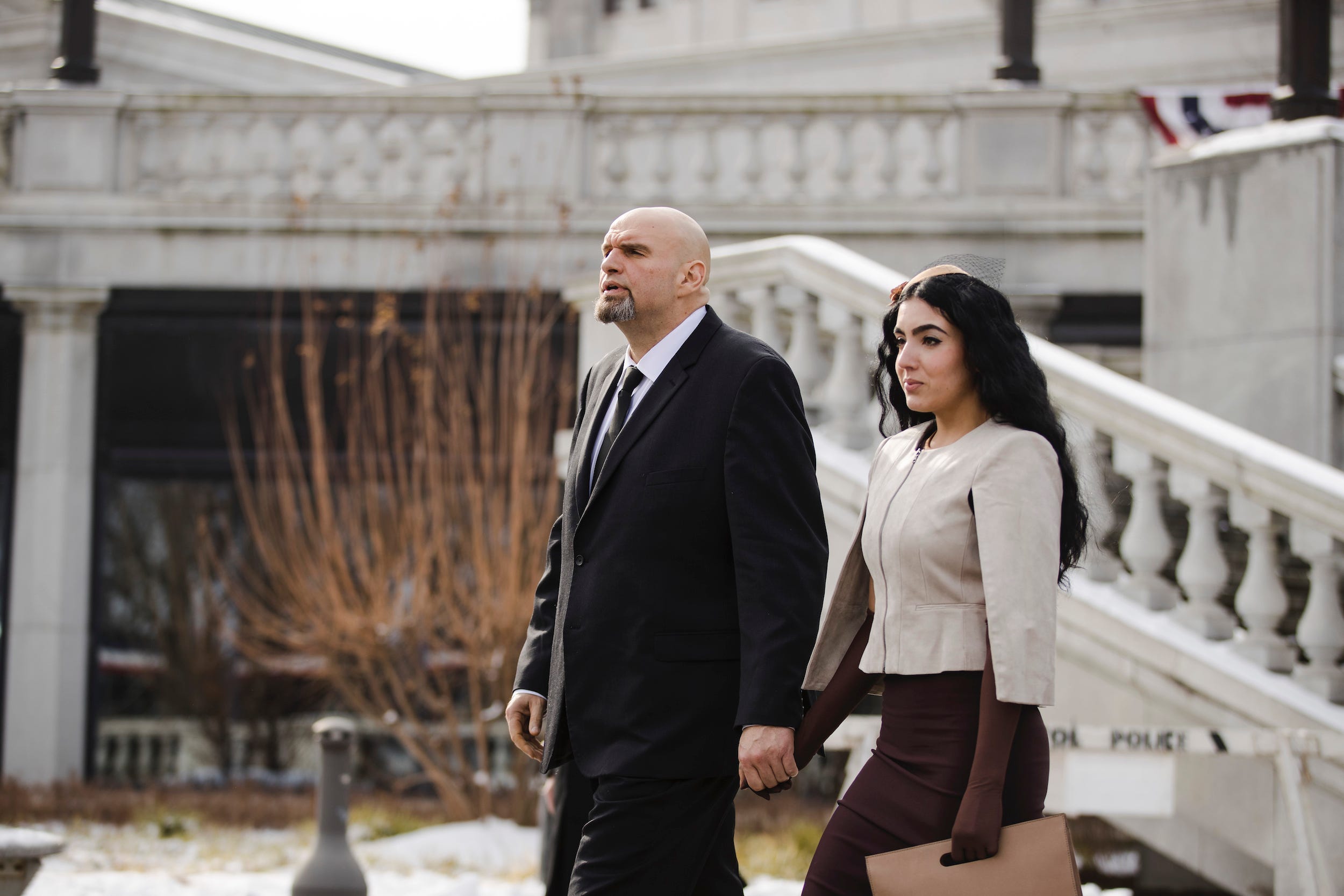 Pennsylvania Lieutenant Governor John Fetterman and his wife Gisele walk to Pennsylvania Gov. Tom Wolf's inauguration, Tuesday, Jan. 15, 2019, at the state Capitol in Harrisburg, Pa. 