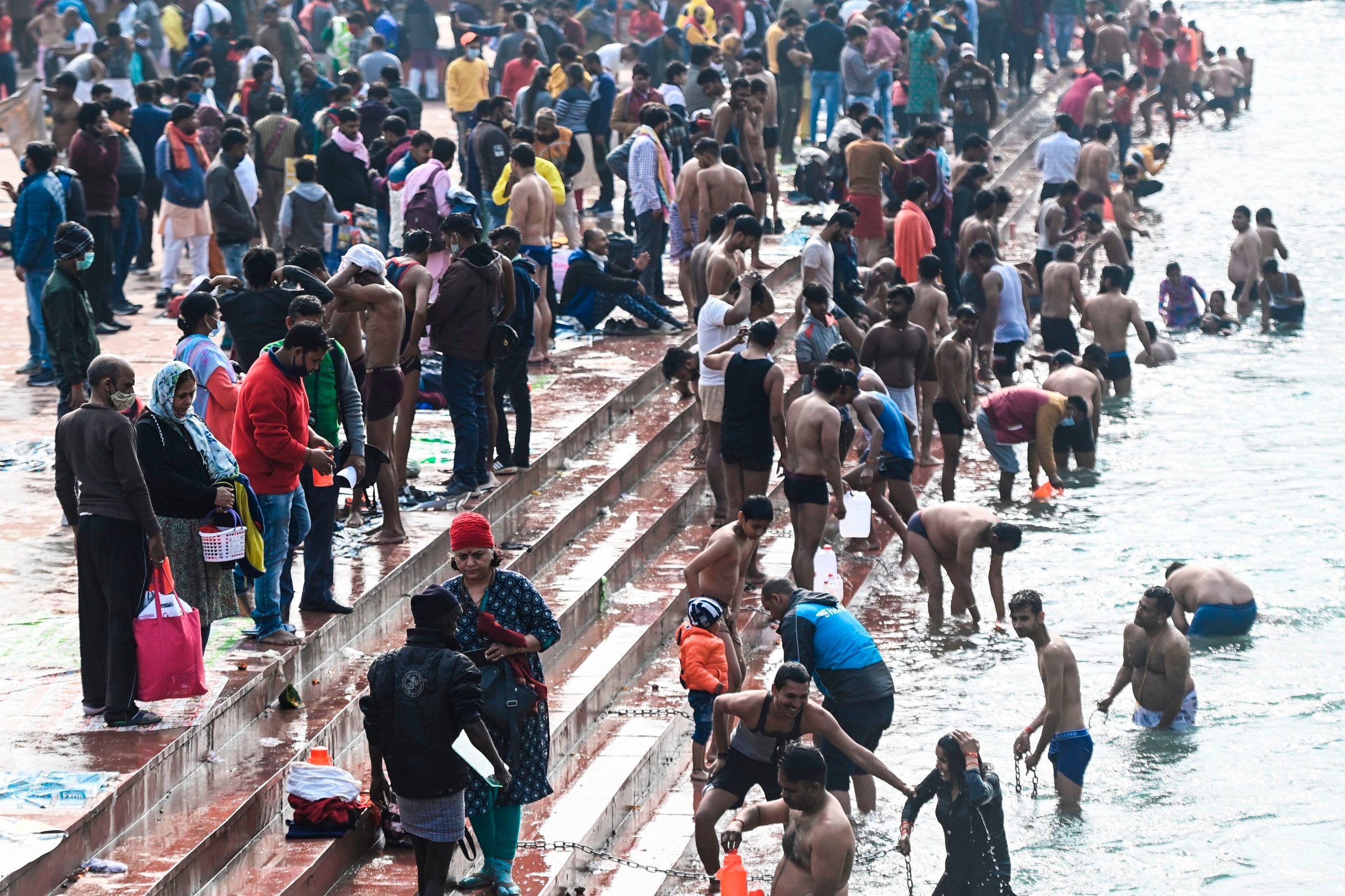 Hindu devotees take a holy dip in the waters of the River Ganges