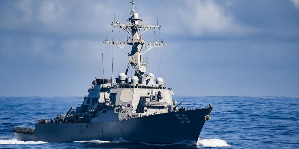 The Arleigh Burke-class guided-missile destroyer USS Russell (DDG 59) transits the Pacific Ocean