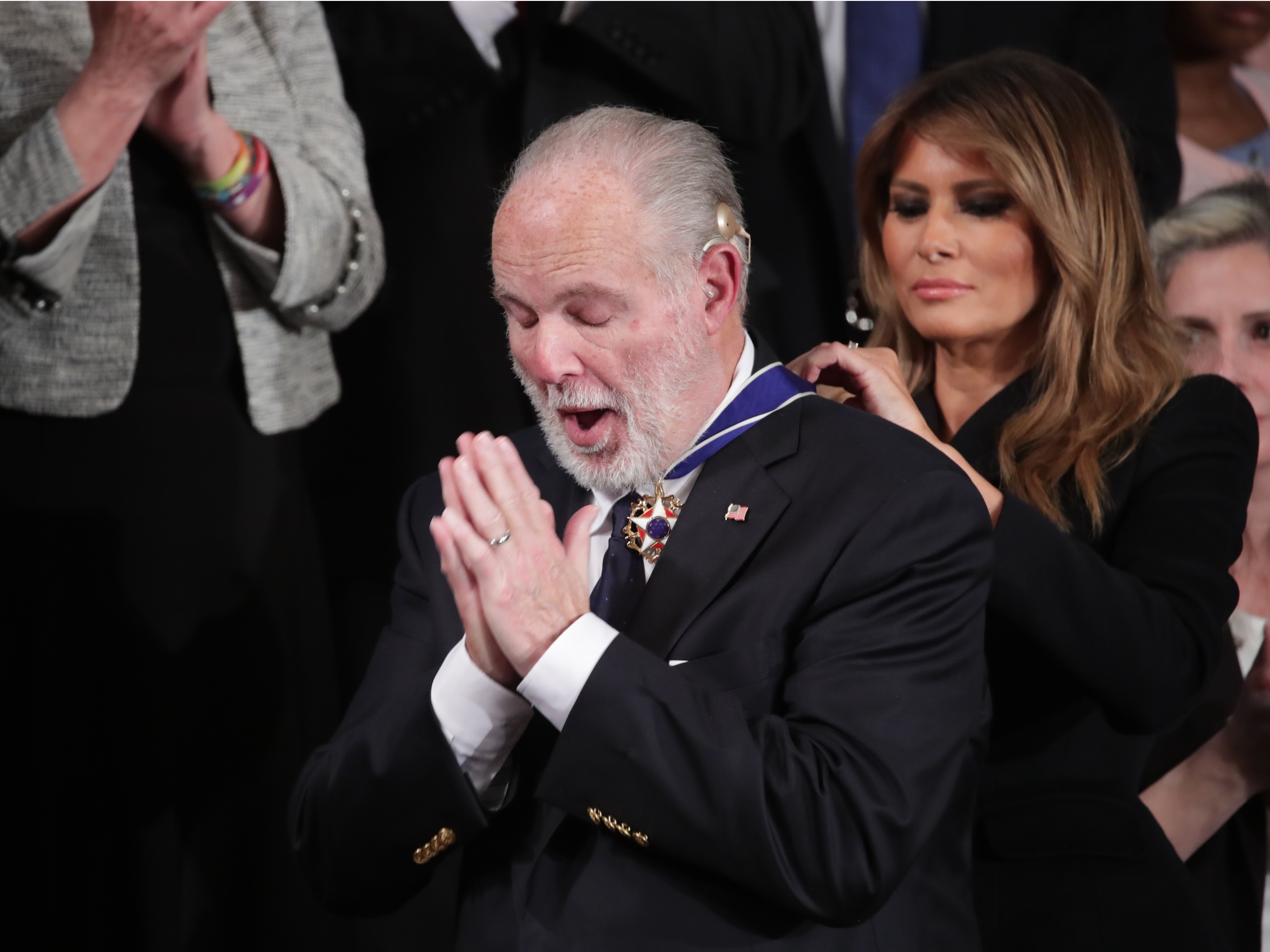First lady Melania Trump places a Presidential Medal of Freedom to Rush Limbaugh during U.S. President Donald Trump's State of the Union address to a joint session of the Congress in the House Chamber of the US Capitol in Washington, DC, on February 4, 2020.