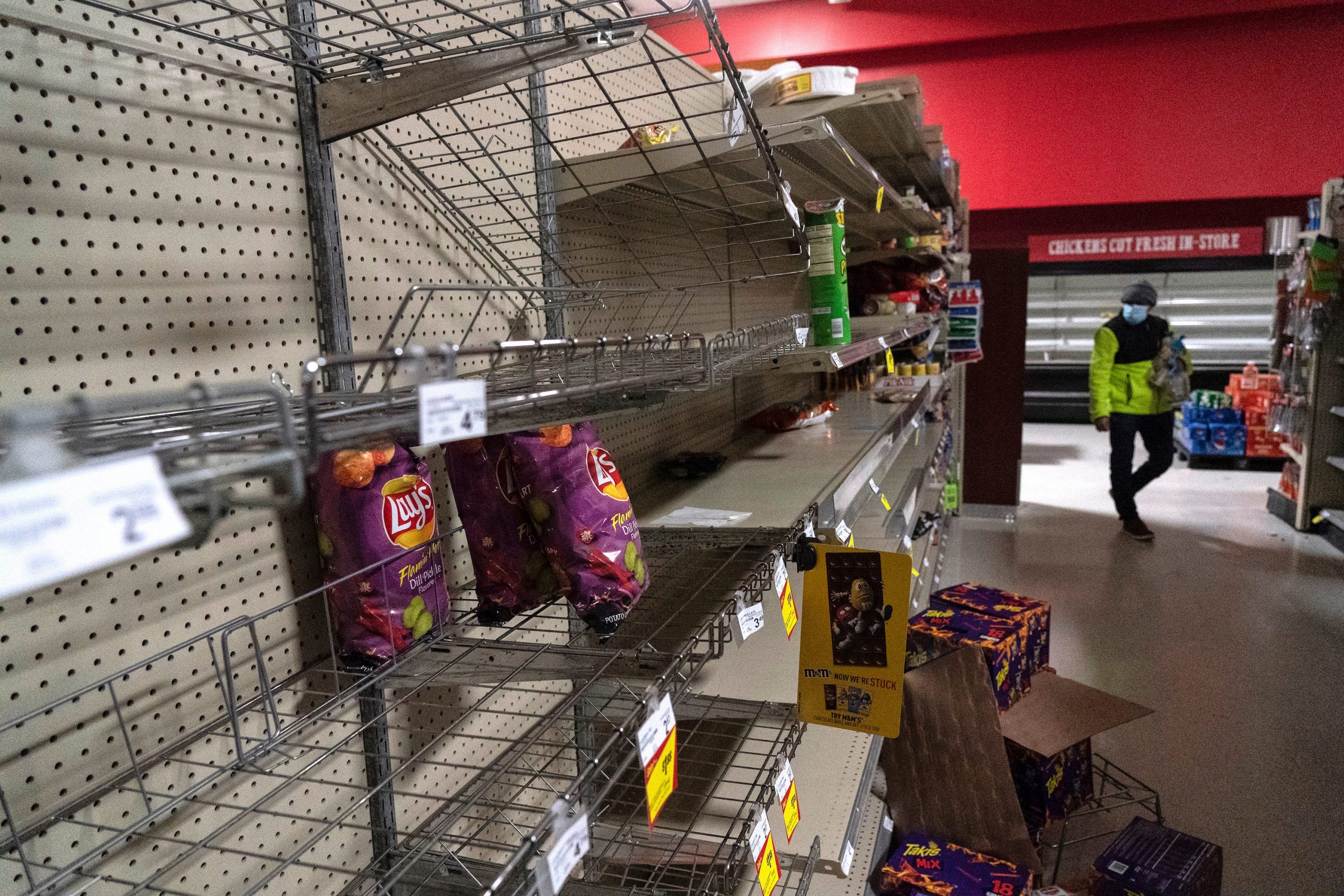 Snack shelves are seen nearly empty in Fiesta supermarket on February 16, 2021 in Houston, Texas.