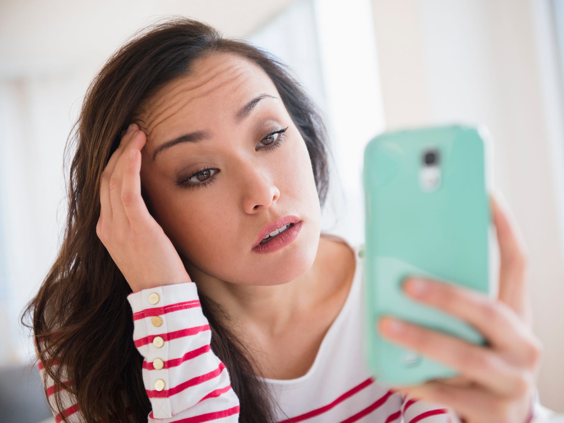 Woman holding Android smartphone