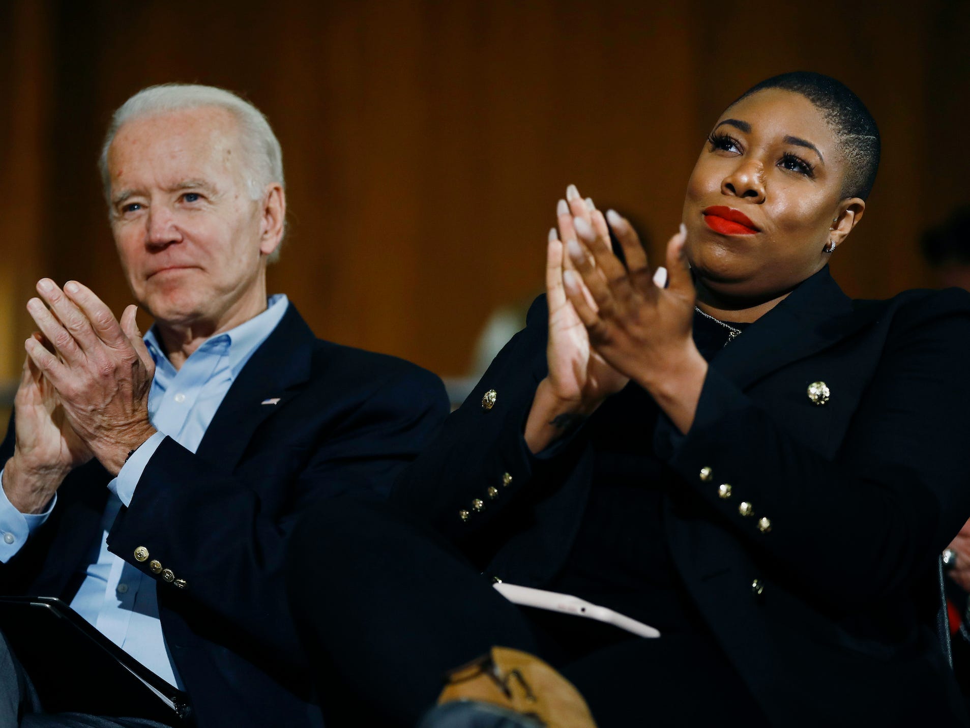 FILE - In this Jan. 27, 2020, file photo, Democratic presidential candidate, former Vice President Joe Biden and senior adviser Symone Sanders participate in a campaign event in Iowa City, Iowa. Biden's status as Democratic presidential nominee-in-waiting means the party will choose another man for an office never held by a woman. But he's running with plenty of women behind him, including a yet-to-be-named vice presidential running mate. (AP Photo/Matt Rourke, File)