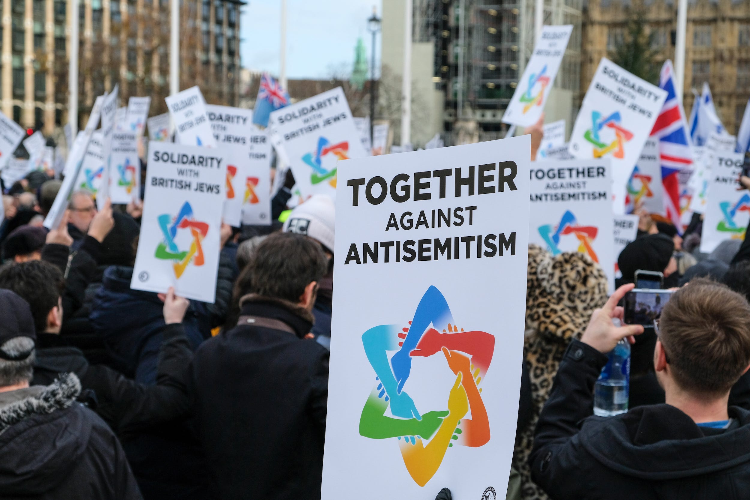 People stage a Together Against Antisemitism rally in London's Parliament Square in December 2019.