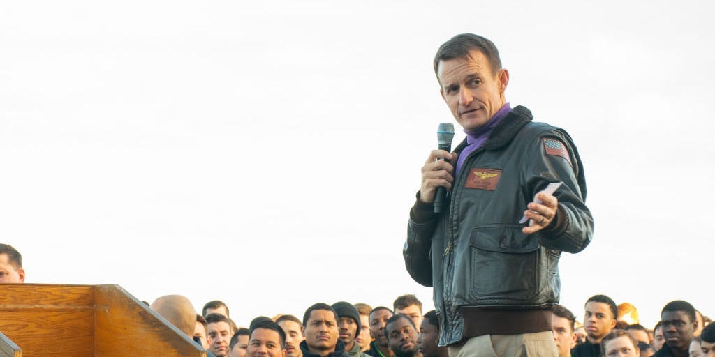 Capt. Brett Crozier, commanding officer of the aircraft carrier USS Theodore Roosevelt (CVN 71), gives remarks during an all-hands call