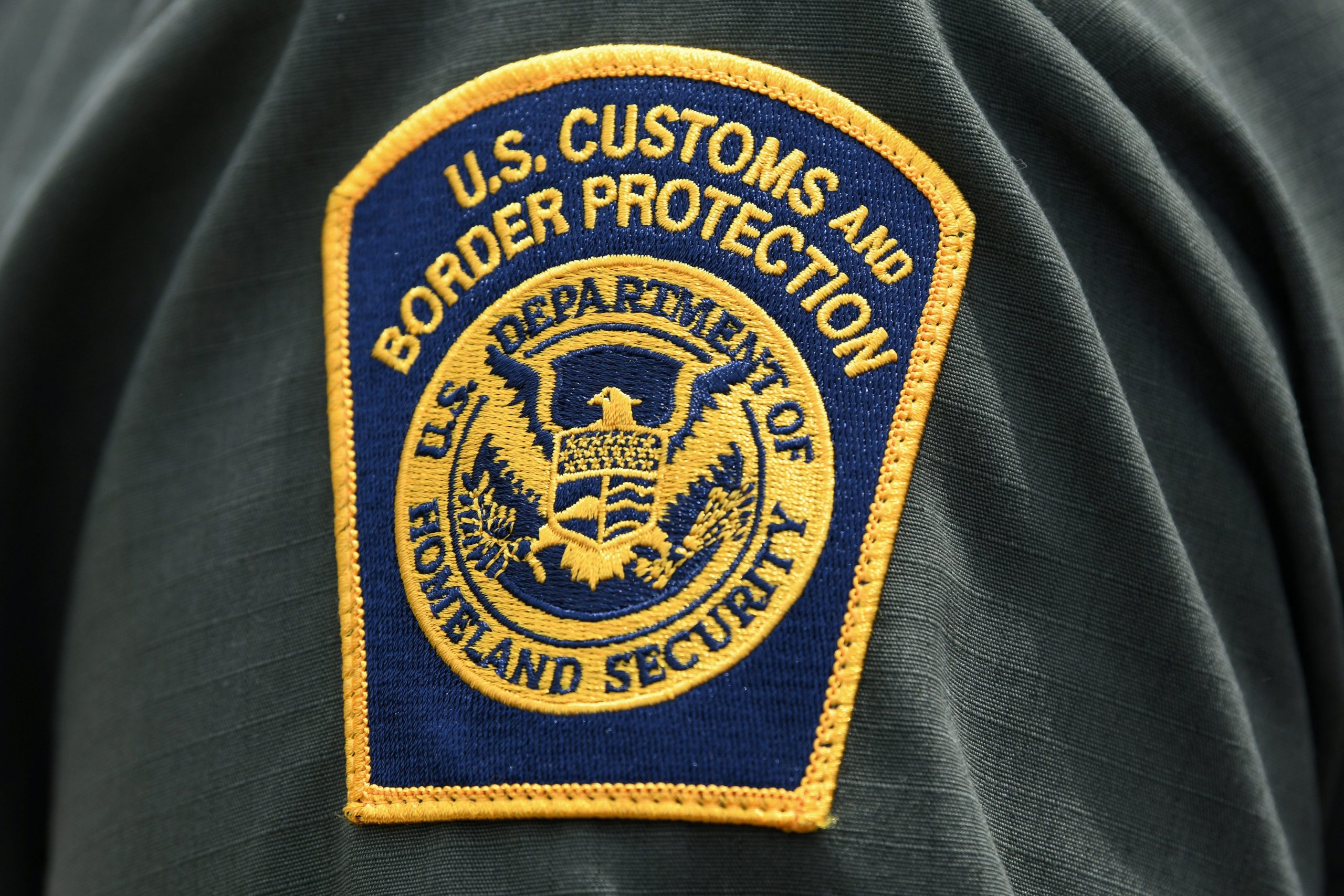 FILE PHOTO: A U.S. Customs and Border Protection patch is seen on the arm of a U.S. Border Patrol agent in Mission, Texas, U.S., July 1, 2019.  REUTERS/Loren Elliott