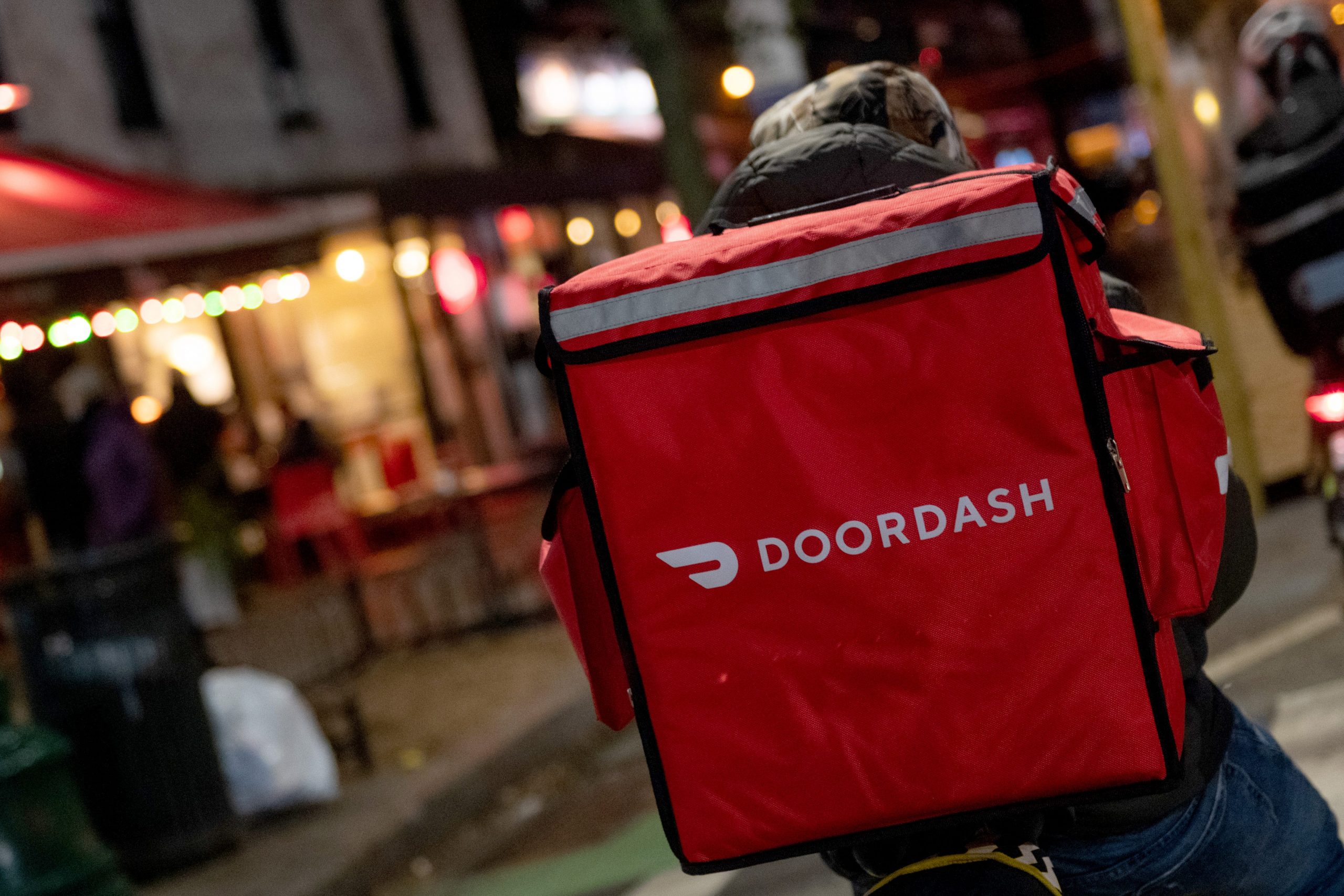 GettyImages 1293837008 NEW YORK, NEW YORK - DECEMBER 30: A door-dash delivery driver waits near a restaurant on December 30, 2020 in New York City. The pandemic continues to burden restaurants and bars as businesses struggle to thrive with evolving government restrictions and social distancing plans which impact keeping businesses open yet challenge profitability. (Photo by NEW YORK, NEW YORK - DECEMBER 30: A door-dash delivery driver waits near a restaurant on December 30, 2020 in New York City. The pandemic continues to burden restaurants and bars as businesses struggle to thrive with evolving government restrictions and social distancing plans which impact keeping businesses open yet challenge profitability. (Photo by Alexi Rosenfeld/Getty Images))