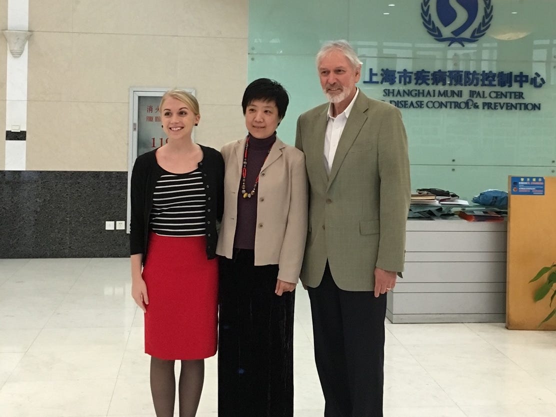 Ashley Frederes, a former employee of Vital Strategies, standing next to Dr. Fan Wu and Alan Lopez in Shanghai.
