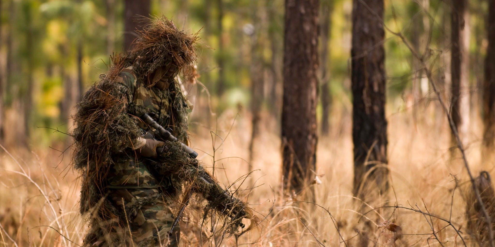 A student of the Special Forces Sniper Course at the John F. Kennedy Special Warfare Center and School moves quietly while avoiding detection during a stalking exercise at Fort Bragg, NC, on January 27, 2011